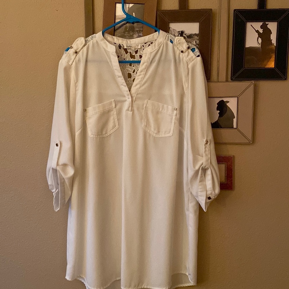 This top, as you can see is a tunic and is in a very light beige